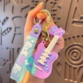 Gitarren-Schlüsselanhänger mit violettem Silikon und Rock AND Roll Armband - Blau und Violett