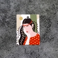 Detailed view of jewelry display card with female illustration on grey concrete surface - Impression No.6 (100 Sheets)
