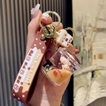 Brown bubble tea liquid quicksand keychain with bear and silicone wrist strap - Mug Bear