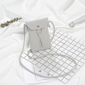 Minimalist grey lychee pattern crossbody phone bag with gold ring and tassel detail - Light Gray
