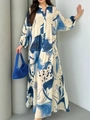 Detail of elegant V-neck and blue abstract floral print on flowing maxi dress - S / Dresses / Blue