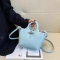 Light blue bucket bag with silver bamboo buckle and litchi texture for women - Small / Blue