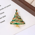 Detailed close-up of a green enamel Christmas tree brooch with colorful rhinestones - Style 19 (5.5*4.1cm)