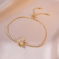 Detail of adjustable gold flower bracelet with sparkling marquise-cut zircon stones - Golden Four Leaf Bracelet / Gold