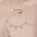 Elegant gold pearl bracelet featuring pink enamel star, moon, and lightning charms - Pink Enamel Star Moon Lightning / Pearl Pink Star Moon