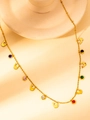 Detail of gold dolphin necklace with colorful zircon stones and fine O-chain links - Multicolor Zirconia Dolphin Necklace