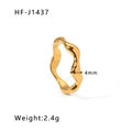 Macro view of 4mm gold wavy geometric stainless steel ring with 2.4g weight detail - US 6 / Gold