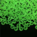 Macro detail of glow-in-the-dark acrylic letter beads for DIY jewelry making in darkness - Letter E (100Pcs/Pack)
