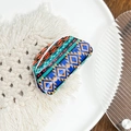 Bohemian acrylic hair claw clip with colorful geometric polka dot pattern on white coaster - Blue Argyle