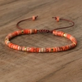 Adjustable hand-woven bracelet with orange natural stone beads and golden spacers - No.50 Orange Imperial
