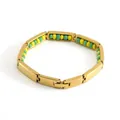 Detalle de pulsera de acero de 8mm mostrando dimensiones de 21cm y un peso de 26 gramos - Dorado