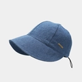 Detail view of washed denim sun hat featuring a gold metal logo plate and drawstring - One Size / Medium Blue