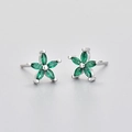 Macro view of flower studs featuring marquise green stones and silver finish - Platinum Green Zirconia