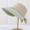 Women's chic wide brim straw sun hat with green ribbon bow on a minimal gold stand - M (56-58cm) / Green