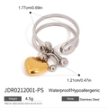 Macro detail of two-tone stainless steel heart ring with waterproof and hypoallergenic tags - Heart Charm Style (JDR0212001-PS)