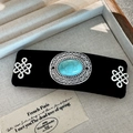 Elegant hair clip with turquoise stone and silver knot design on black velvet base - Silver Chinese Knot Turquoise Clip