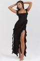 Close-up of elegant black maxi dress with ruffle edges and stylish high side slit detail - S / Black