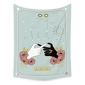 Macro shot of Gemini constellation tapestry with soft blue fabric and floral astrology art - Gemini