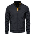 Detail of men's black stand collar jacket with vibrant yellow lining and zip pockets - XXL / Black