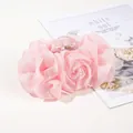 Detail of pink chiffon rose hair claw clip with transparent resin and gold spring - Pink