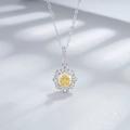 Macro detail of sunflower pendant with yellow ice-cut diamond and silver chain - 925 Silver / Yellow Zirconia Necklace