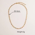 Macro detail of multicolored enamel heart links and gold chain with dimensions - Abstract Moon Necklace