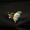 Macro view of gold butterfly ring with white enamel and orange marquise gemstone detail - Adjustable Open / Gold Metal White Enamel Butterfly (JZ4188)