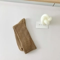 Cozy brownish-tan ribbed knit crew socks displayed with minimalist home decor items - Coffee