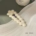 Elegant BB hair clip featuring cream pearl flower design on a gold-plated metal base - Hollow Flower Waterdrop Clip