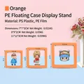 Set aus 3 orangen PE-Film 3D Schweberahmen für Ringe und Schmuckaufbewahrung - Runder Sockel / Orange