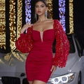 Detail of red party dress showing voluminous lantern sleeves with 3D petals and sequins - S / Red