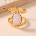 Detailed close-up of a vintage gold-plated ring with a pink oval gemstone and double-line band - One Size / Light Pink Natural Stone