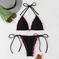Halter bikini set with pink ruffle trim and gold pendant on a beach-themed background - Black