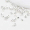 Close-up of polished silver metal spacer beads for DIY bracelet and jewelry making - 2x2mm / Thick Silver