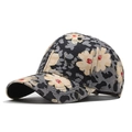 Detail view of cotton baseball cap with beige flower embroidery and leopard print - One Size / Black