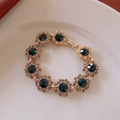 Golden flower chain bracelet with deep blue center stones and clear diamond accents - 10# Bracelet - Gold - Flower