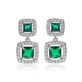 Macro detail of emerald cut crystal earrings with silver tassels and pave zircon stones - Platinum Green Zirconia