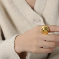 Minimalist thick curved ring in 18K gold finish shown on model finger in a modern style - US 6 / Gold
