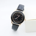 Detail of rose gold case and black leather strap on a stylish quartz watch for women - Black