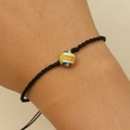 Adjustable black braided rope bracelet featuring a blue yellow white volleyball bead - Volleyball Style (3423)