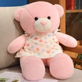 Pink plush teddy bear in beige polka dot dress sitting on a cozy beige sofa indoors - 80cm(1kg) / Pink