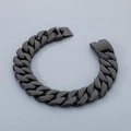 Detailed view of the bold 31mm black cuban link chain in vacuum plated stainless steel - Black