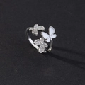 Detailed macro shot of an open silver butterfly ring with cubic zirconia and white enamel - Style D-Silver Three Butterflies Mixed Material