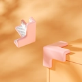 Paraspigoli rosa in silicone a forma di L con adesivo per la sicurezza dei bambini - Forma a T Rosa