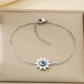 Detailed close-up of a silver sunflower bracelet with opal blue evil eye beads in a jewelry box - Silver Sunflower Evil Eye (KB168250-KFC)