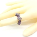 Elastic amethyst chip ring featuring irregular natural purple stones on a model hand - Amethyst