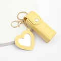Yellow PU leather lipstick case keychain with heart-shaped mirror on a white background - Yellow