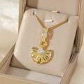 Gold fan-shaped pendant necklace with cubic zirconia pavé and center stone on beige silk - Gold Fan Pendant Necklace (NE62盒子链)