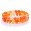 Natural orange carnelian bead bracelets set with smooth round gemstone texture on white background - Round Beads / Orange Agate