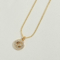 Gold star-shaped necklace with a Cancer zodiac crab pendant and small white diamonds - Sun
